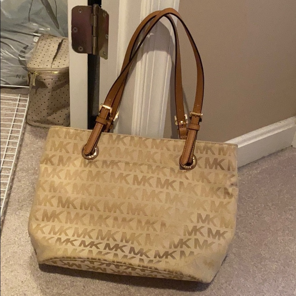 Michael Kor’s tan bag NWOT